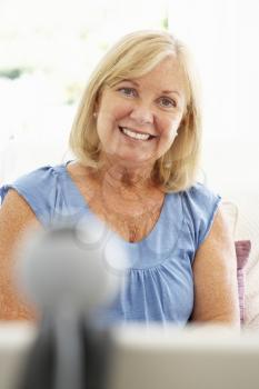 Senior woman using skype