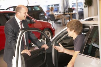 Young man buying new car