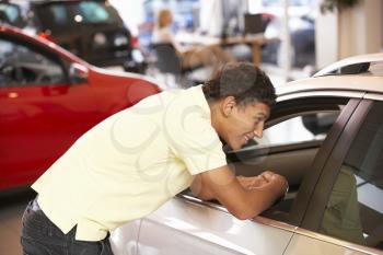 Young man buying new car