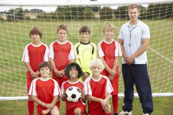 Junior soccer team and coach portrait