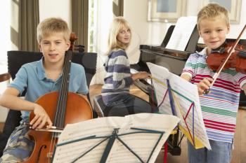 Children playing musical instruments at home
