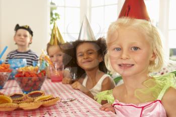 Young children eating at birthday party