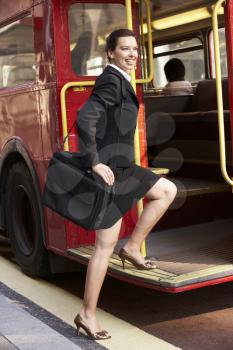 Businesswoman boarding Routemaster bus