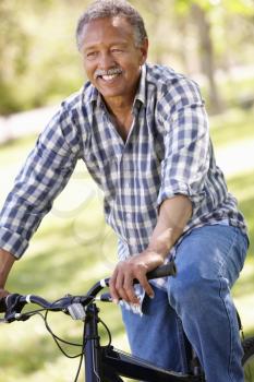 Senior  man cycling in park
