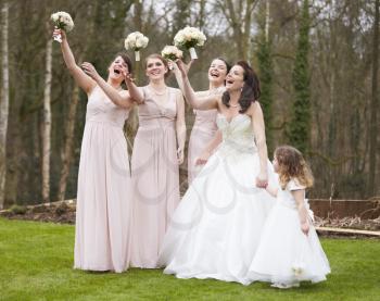 Bride With Bridesmaids On Wedding Day