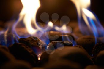 Close Up Of Flaming Coals On Gas Fire