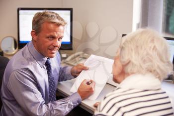 Doctor Discussing Test Results With Senior Female Patient