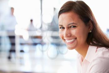Portrait of smiling woman in office