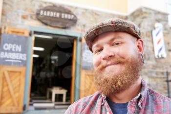 Portrait Of Hipster Barber Standing Outside Shop