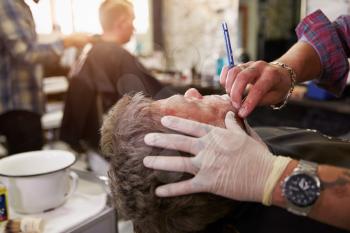 Barber Shaving Client With Cut Throat Razor