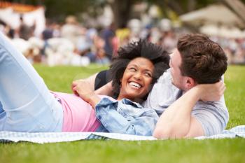 Couple Relaxing At Outdoor Summer Event