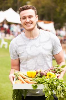 Man With Fresh Produce Bought At Outdoor Farmers Market