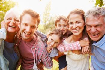 Multi-generation family having fun together outdoors