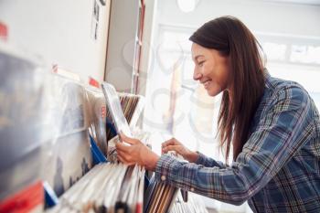 Woman selecting records at a record shop