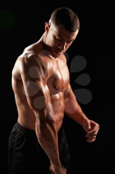 Male bodybuilder flexing muscles