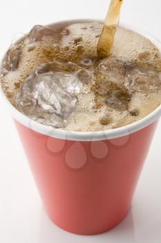 Cola Being Poured Into Paper Cup