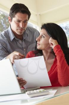 Hispanic Couple Working In  Home Office