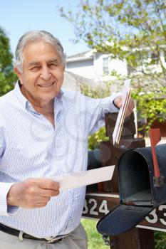 Senior Hispanic Man Checking Mailbox
