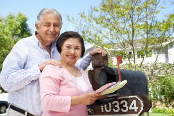 Senior Hispanic Couple Checking Mailbox