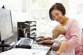 Senior Hispanic woman with computer and baby