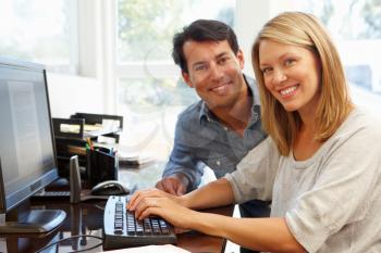 Couple working in home office