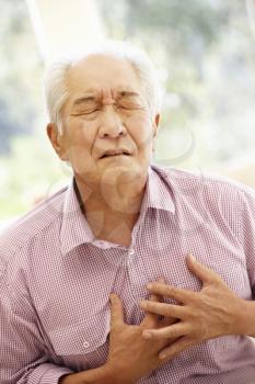 Senior Asian man with chest pain