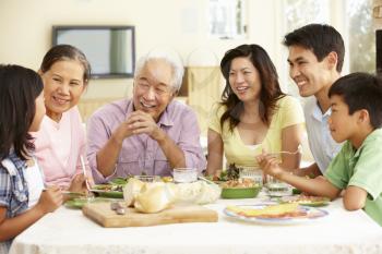 Asian family sharing meal at home