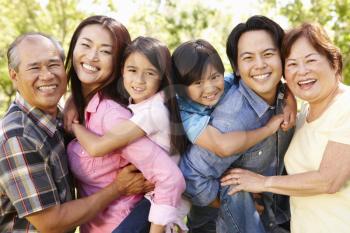 Portrait multi-generation Asian family in park