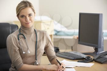 Female Doctor sitting at desk