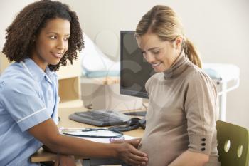 Nurse with pregnant woman patient