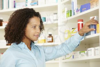 Female pharmacist working in UK pharmacy
