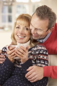 Portrait mature couple relaxing at home
