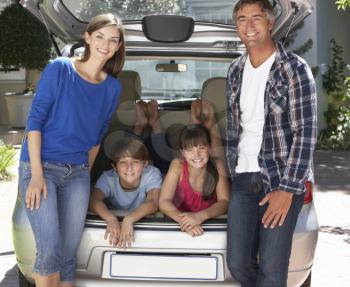 Family Sitting In Trunk Of Car