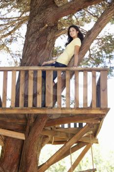 Teenage Girl In Treehouse