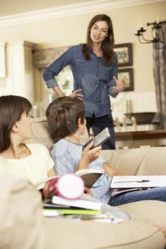 Mother Tells Children Off For Watching TV Whilst Doing Homework