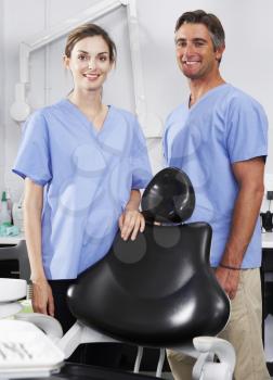 Portrait Of Dentist And Nurse In Surgery