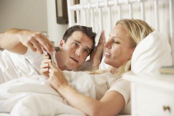 Husband Complaing As Wife Uses Mobile Phone In Bed