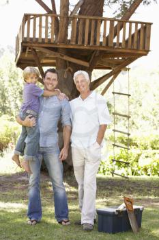 Grandfather, Father And Son Building Tree House Together