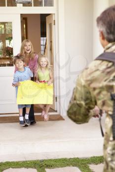 Soldier Returning Home And Greeted By Family