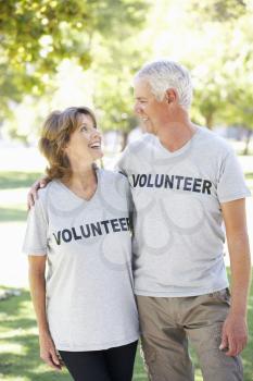 Senior Couple Working As Part Of Volunteer Group