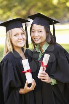 Two Female Students Attending Graduation Ceremony