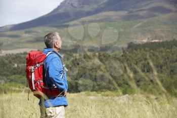 Senior Man On Hike Through Beautiful Countryside