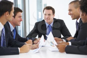 Group Of Businessmen Having Meeting In Office