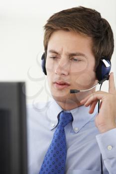 Service Agent Talking To Customer In Call Centre