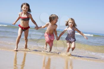 Children Running Along Beach
