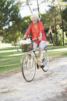 Senior Woman Enjoying Cycle Ride