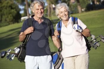 Senior Couple Enjoying Game Of Golf