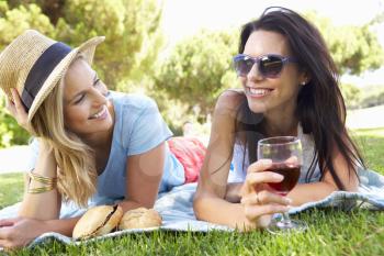 Two Female Friends Enjoying Picnic Together