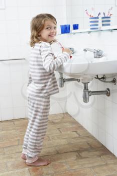 Girl In Bathroom Brushing Teeth