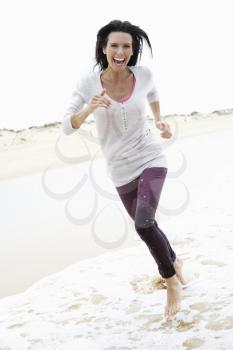 Woman Running Along Beach